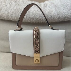 ALDO women's handbag with a top handle and chain detail.